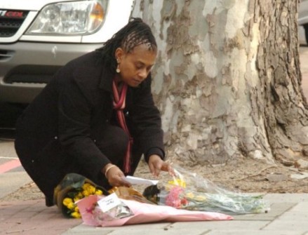 Doreen Lawrence laying flowers at the place where her son was savagely murdered.