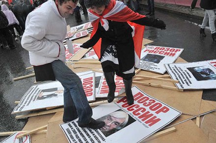 Nashi supporters trample on posters showing opposition images
